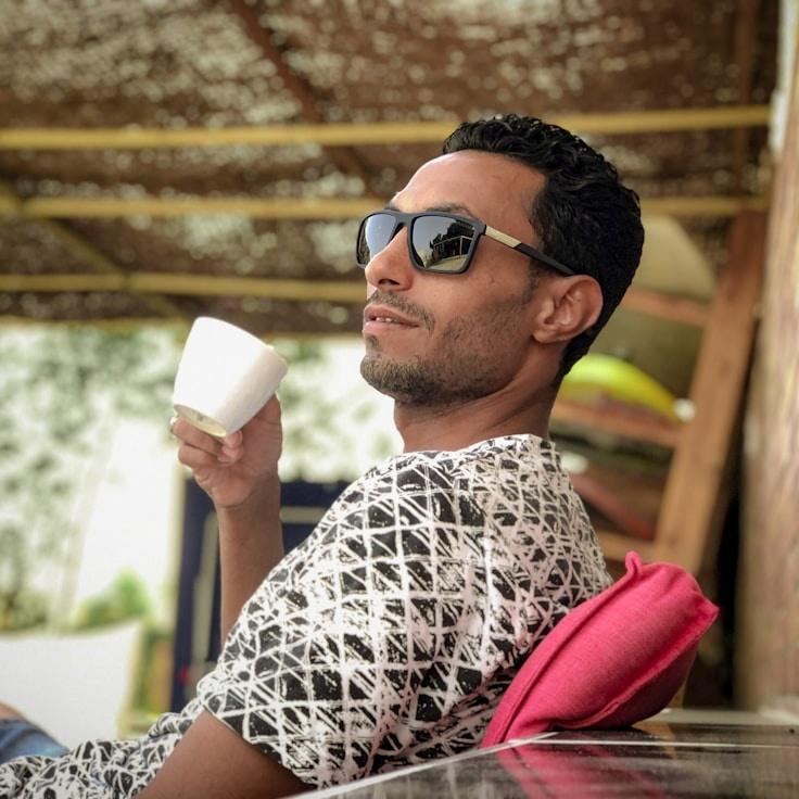 Kaveri Mehta, Lead Design Curator at DawnMeadowWorks, reviewing corporate floral arrangements